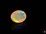 a white oplite stone with a black background