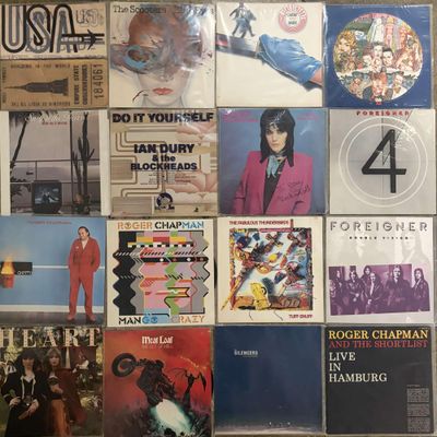 the album covers of various albums are displayed on the wall