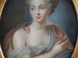 portrait of a woman in a blue dress holding a red shawl