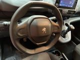 the interior of a car with a steering wheel and dashboard controls