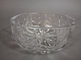 a glass bowl that is sitting on a table