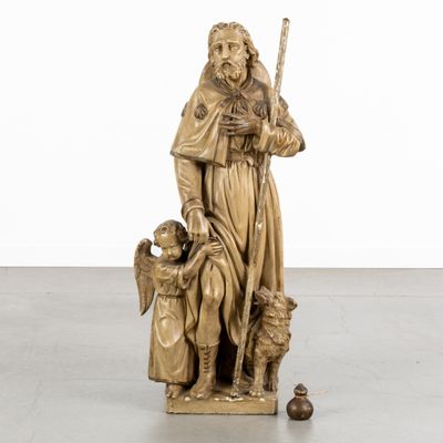 an image of a statue of a man with a child and a dog