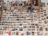a lot of old postcards on the table