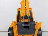 a yellow toy truck that is sitting on the floor