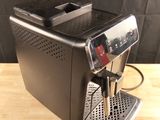 a coffee machine that is sitting on a wooden table