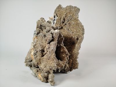a piece of rock that is sitting on a white surface