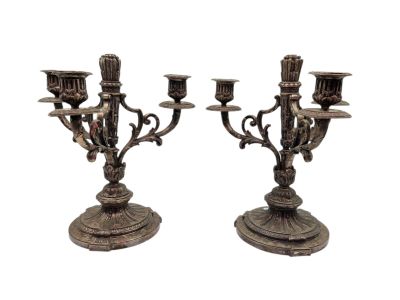 pair of antique silver plated candelabs with candles
