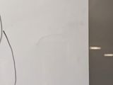 a picture of a drawing of a cat on the wall