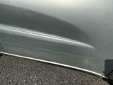 a close up of a car ' s door handle on the side of the road