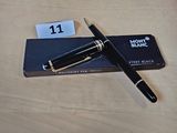 un stylo posé sur une boîte