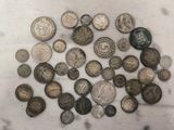 a lot of coins that are on the table