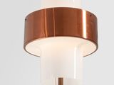 a close up of a lamp on a metal pole with a glass shade