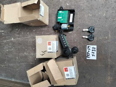 several boxes and a pair of scissors sitting on the ground
