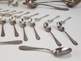 a lot of silver spoons and spoon spoons on the table