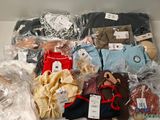 a box full of clothes and a teddy bear in it