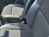 the interior of a car with black leather seats in a parking lot