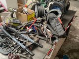 a table with a bunch of tools on it in a garage