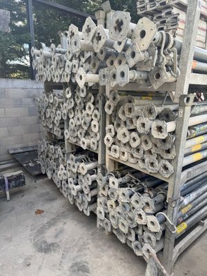 several rolls of toilet paper are stacked on a rack in a warehouse
