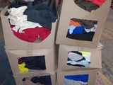 a carton full of clothes sitting on a pallet