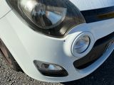 a close up of a car ' s headlight on the front of the car