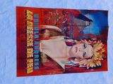 an old movie poster of a woman with a flower in her hair
