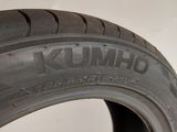 a close up of a tire on a white surface