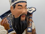a figurine of a man with a long beard and a hat