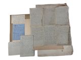 an old book with a bunch of papers on top of it