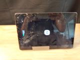 someone is taking a picture of a broken laptop screen on a table