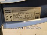 the label is on the back of a blue chair that is in a box