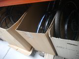 many bikes that are sitting in boxes on the floor