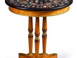 une image représentant une table ronde avec un plateau en mosaïque