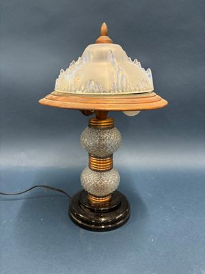 an image of a table lamp with a glass dome on top