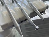 dental equipment sitting on a table in front of a window