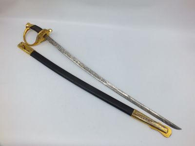 two swords with gold and black handles on a white surface