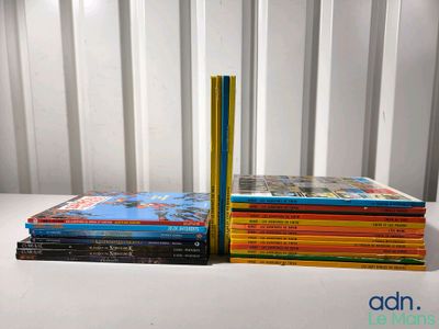 several children ' s books stacked on top of each other on a table