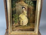 an old picture of a woman in a yellow dress standing next to a wooden easel