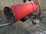 a red fire hydrant with a hose attached to it