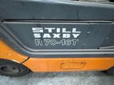 a close up of a forklift with the words still saxby written on it
