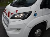 a white van that is parked on the side of the road