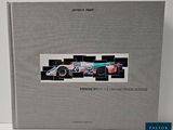 a book with a picture of a racing car on it