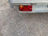 an image of a flat bed trailer parked on the side of the road