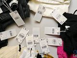 a lot of clothes that are sitting on a table