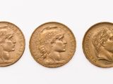 three gold sovereigns, one of which is a sovereign and one of which is a sovereign