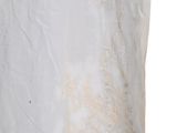 a close up of a white shirt with gold embroidery on it