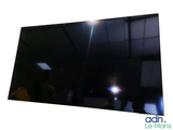 someone is taking a picture of a television screen in a dark room