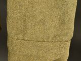 a close up of a brown jacket hanging on a clothes line