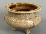 a small ceramic pot that is sitting on a table