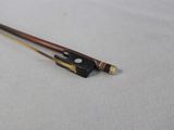 two wooden chopsticks sitting on a white surface
