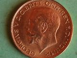 a close up of a penny on a green surface